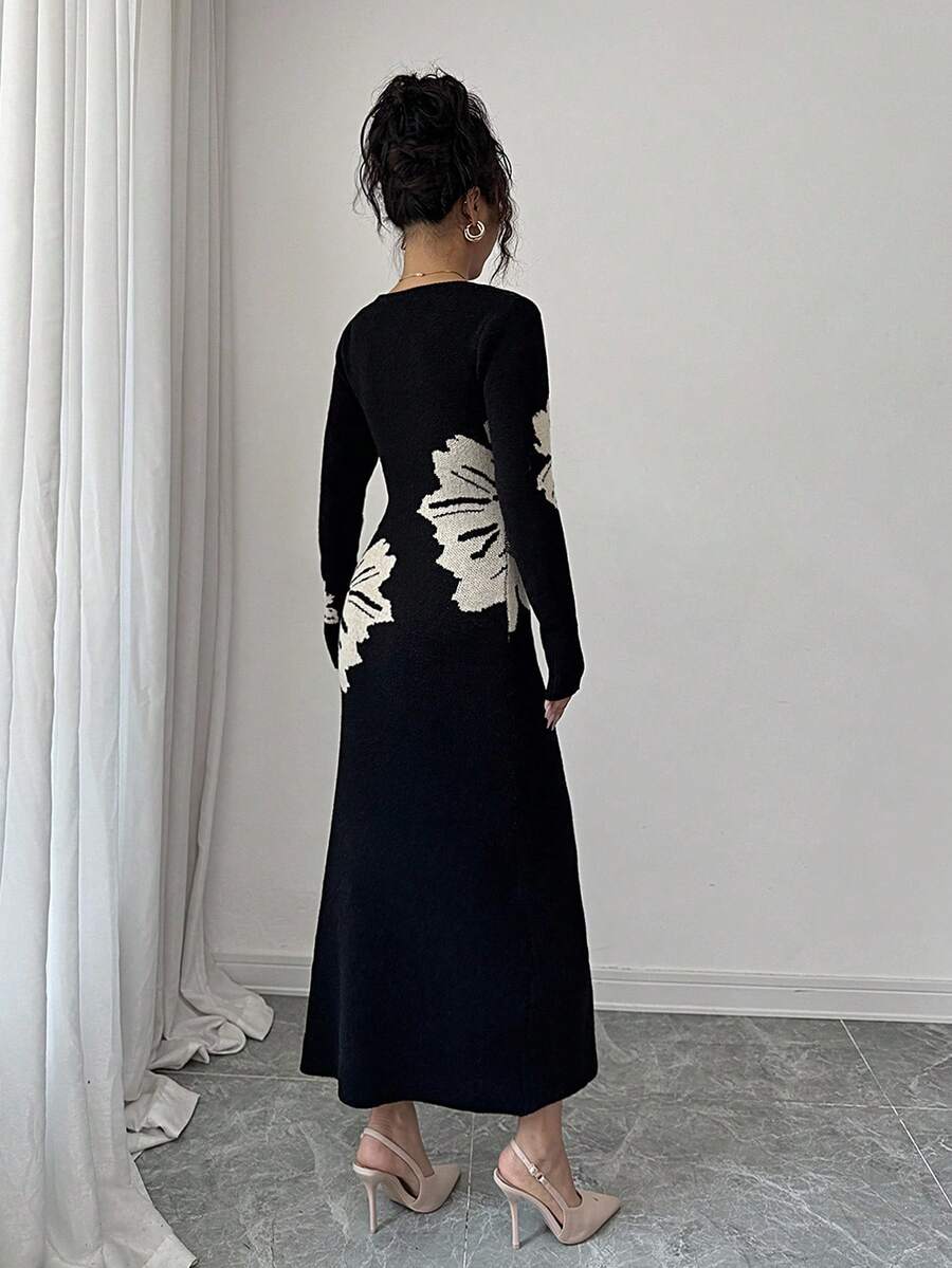 Back full view of black and cream floral slim-fit knit midi dress with subtly flared hem