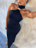Navy maxi dress selfie with asymmetric halter neckline and gold connector