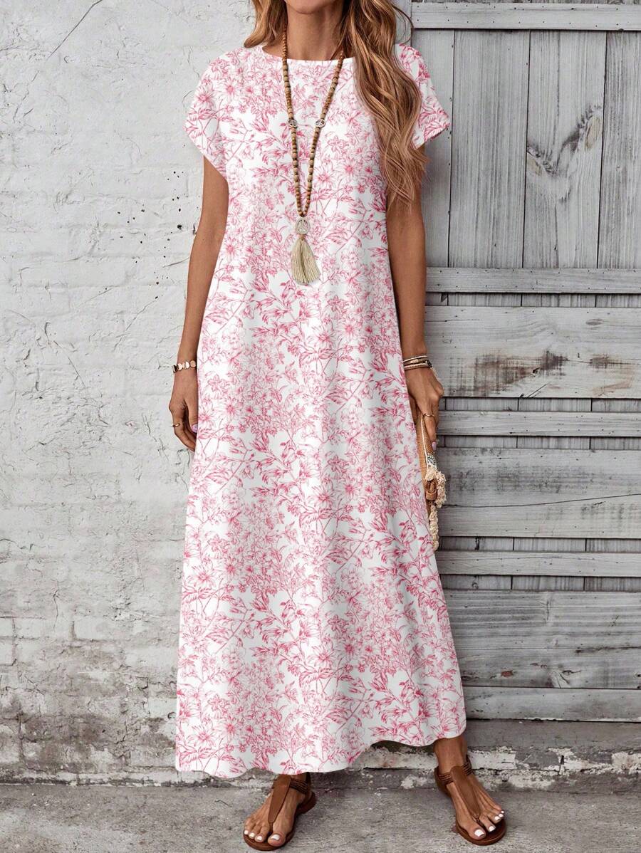 Close front view of beige boho maxi dress with geometric chest and hem print