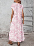 Front view of pink floral loose maxi dress with round neckline