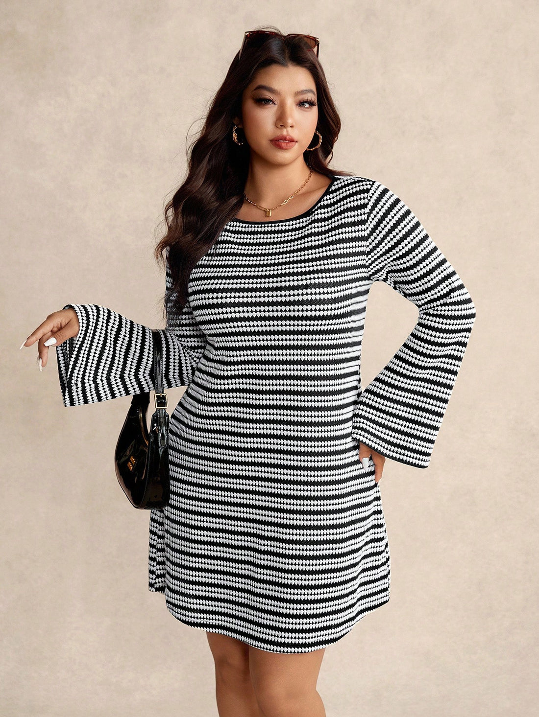 Turn heads this fall in our Plus Size Striped Casual Dress, designed with a playful flare! Featuring a comfy round neck and whimsical flare sleeves, it blends style and ease perfectly. The flattering stripes add a fun twist, making it a must-have for your cozy autumn wardrobe. Whether out for brunch or a casual day about town, this dress keeps you looking fabulous and feeling free!