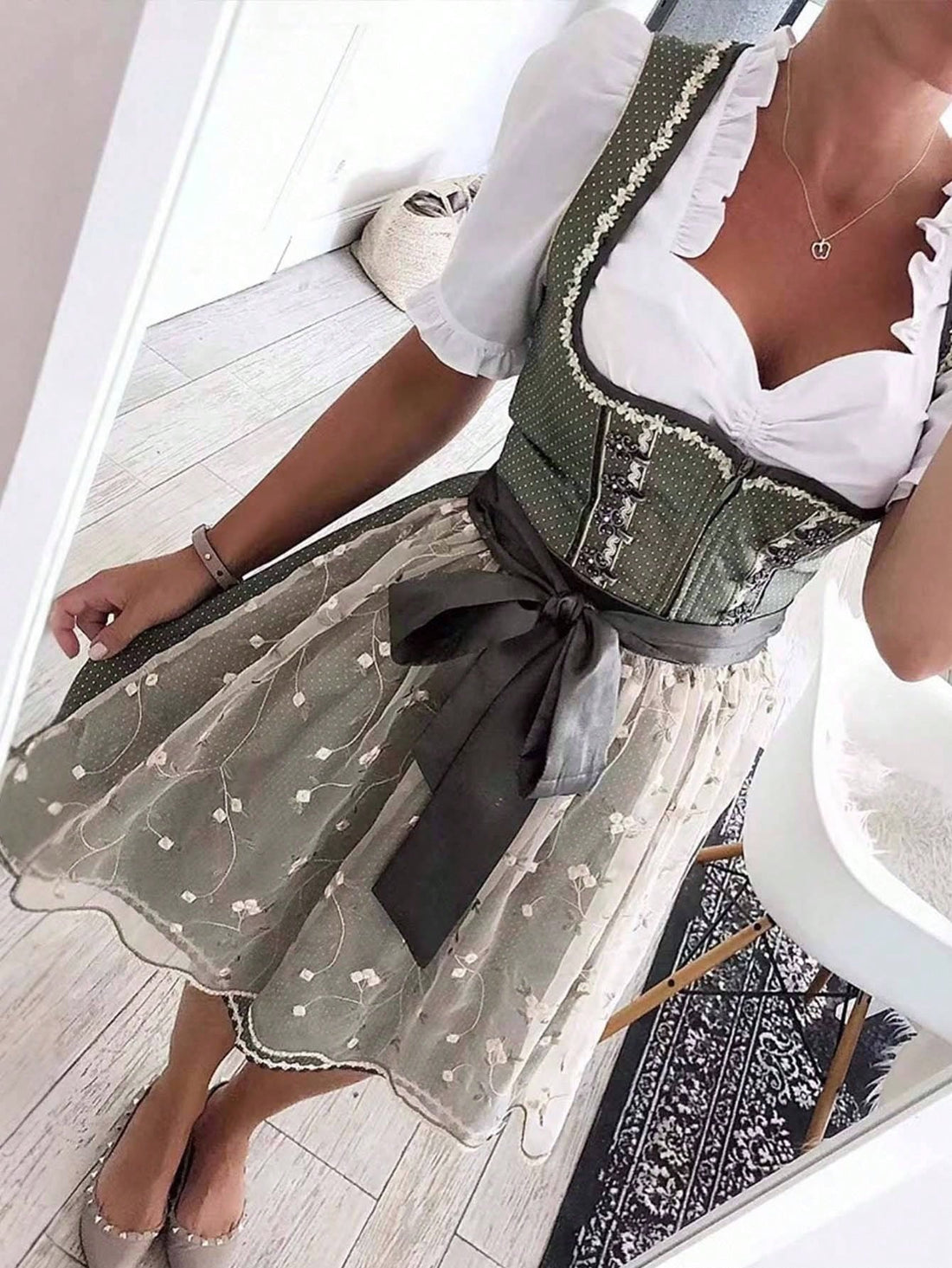 Step into a garden of charm with this elegant green dress, adorned with delicate floral embroidery and flirty lace accents. Perfect for turning heads at any event, its playful details add a fresh, feminine touch that keeps your style blooming all day long.