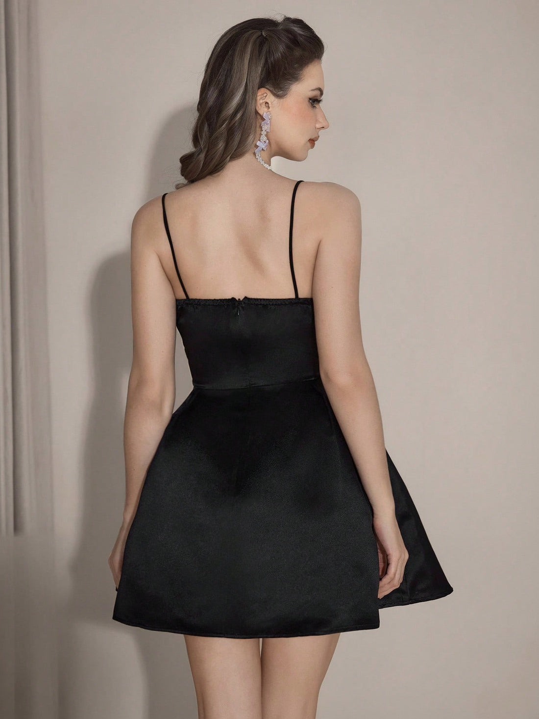 Turn heads at your next event in this stunning black cocktail dress that effortlessly blends sophistication with fun. The off-shoulder neckline creates an alluring, romantic silhouette while the graceful A-line cut flatters every figure. Delicate floral embellishments add a touch of whimsy and texture, transforming a classic black dress into something truly special. Perfect for cocktail parties, weddings, or any occasion where you want to feel confident and fabulous. Slip into elegance and let your style do
