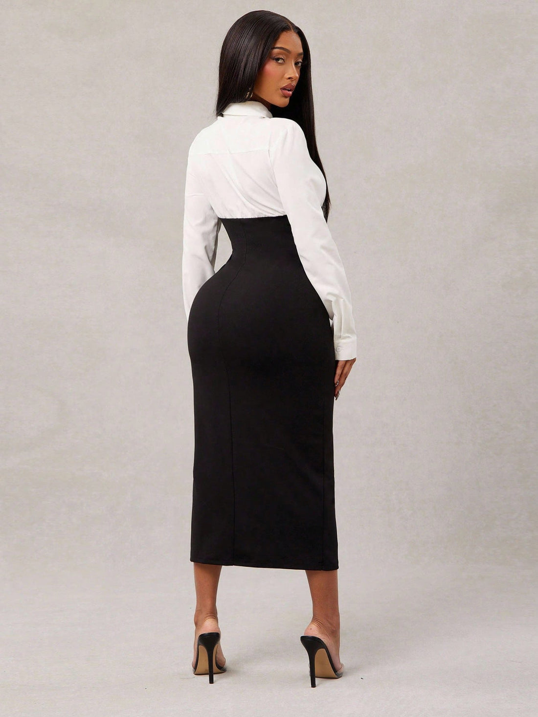 Step into the spotlight with this elegant black and white color block bodycon dress. Its sleek long sleeves and flattering fit bring a professional edge while letting your playful side shine. Perfect for meetings or after-hours events, this dress combines sophistication with a dash of fun for women who mean business—and know how to have a good time.
