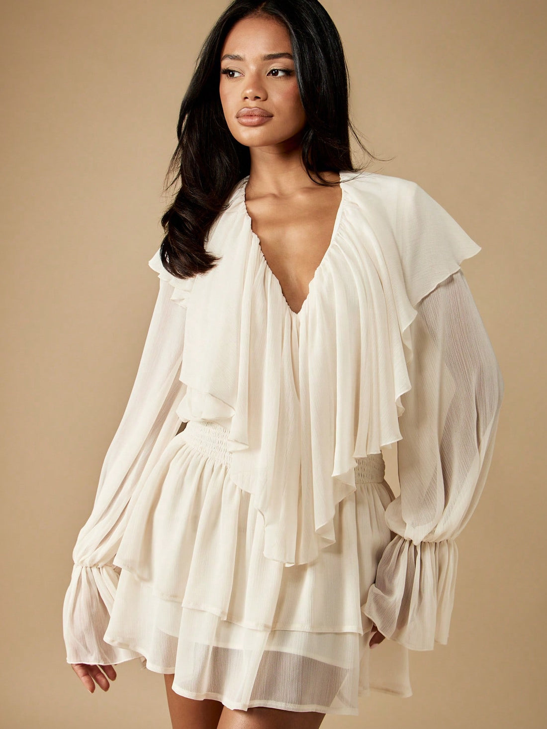 Twirl into spring and summer celebrations in this enchanting ruffle mini dress! Crafted from lightweight, flowing chiffon, this dress features charming balloon sleeves that add a whimsical touch to your special occasion look. The delicate ruffled details create movement and dimension, perfect for weddings, garden parties, and romantic getaways. Whether you're a guest or the star of the show, this playful piece brings effortless elegance and a hint of fun to any warm-weather event. Pair it with strappy heels