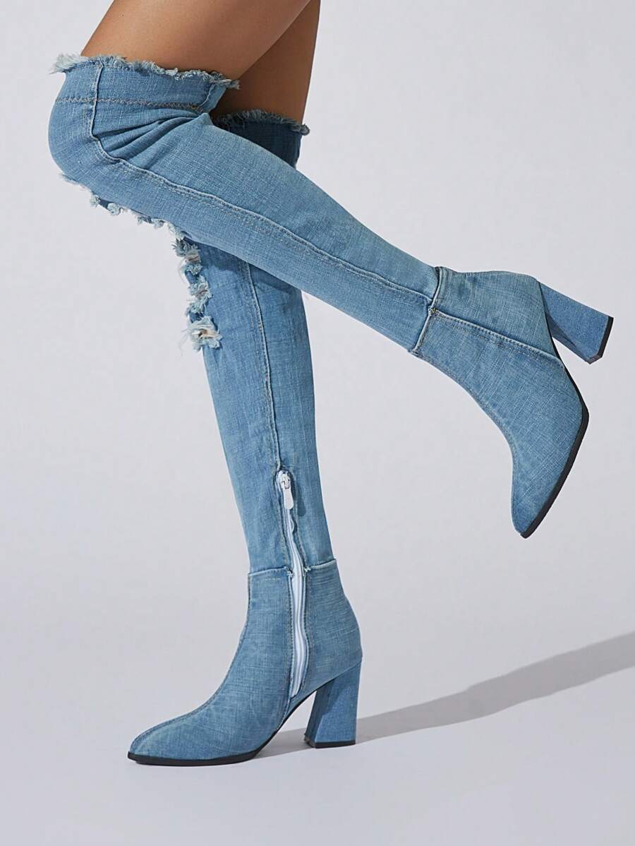 Step out boldly in these Stylish Women's Denim Thigh High Boots, designed to turn heads with their cool cutout details. The over-the-knee length offers a fierce, fashion-forward look while the classic blue jean material adds a touch of casual chic. Perfect for making every outfit unforgettable, these boots blend comfort with edge for your ultimate style upgrade.