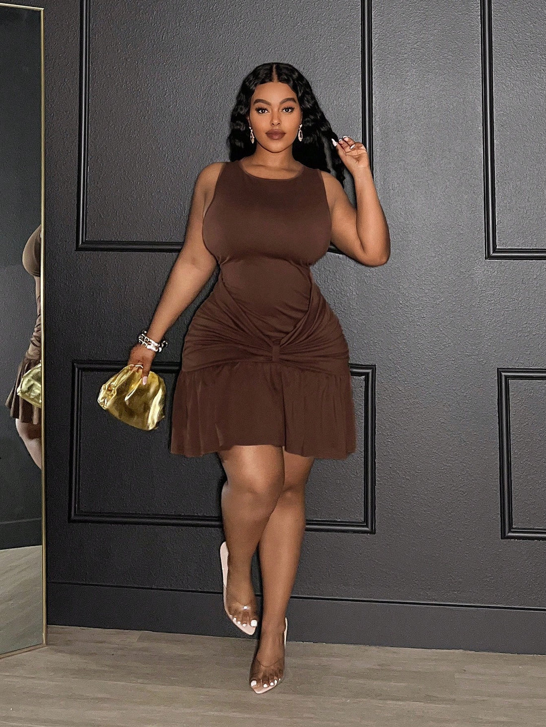 Step out in style with this playful yet elegant plus-size mini dress, perfect for spring and summer date nights. The solid brown hue complements any skin tone, while the flirty ruffle hem adds movement and charm. A ruched waist flatters your figure, offering a touch of sass with every step. This dress combines comfort and confidence, making your special evenings unforgettable.