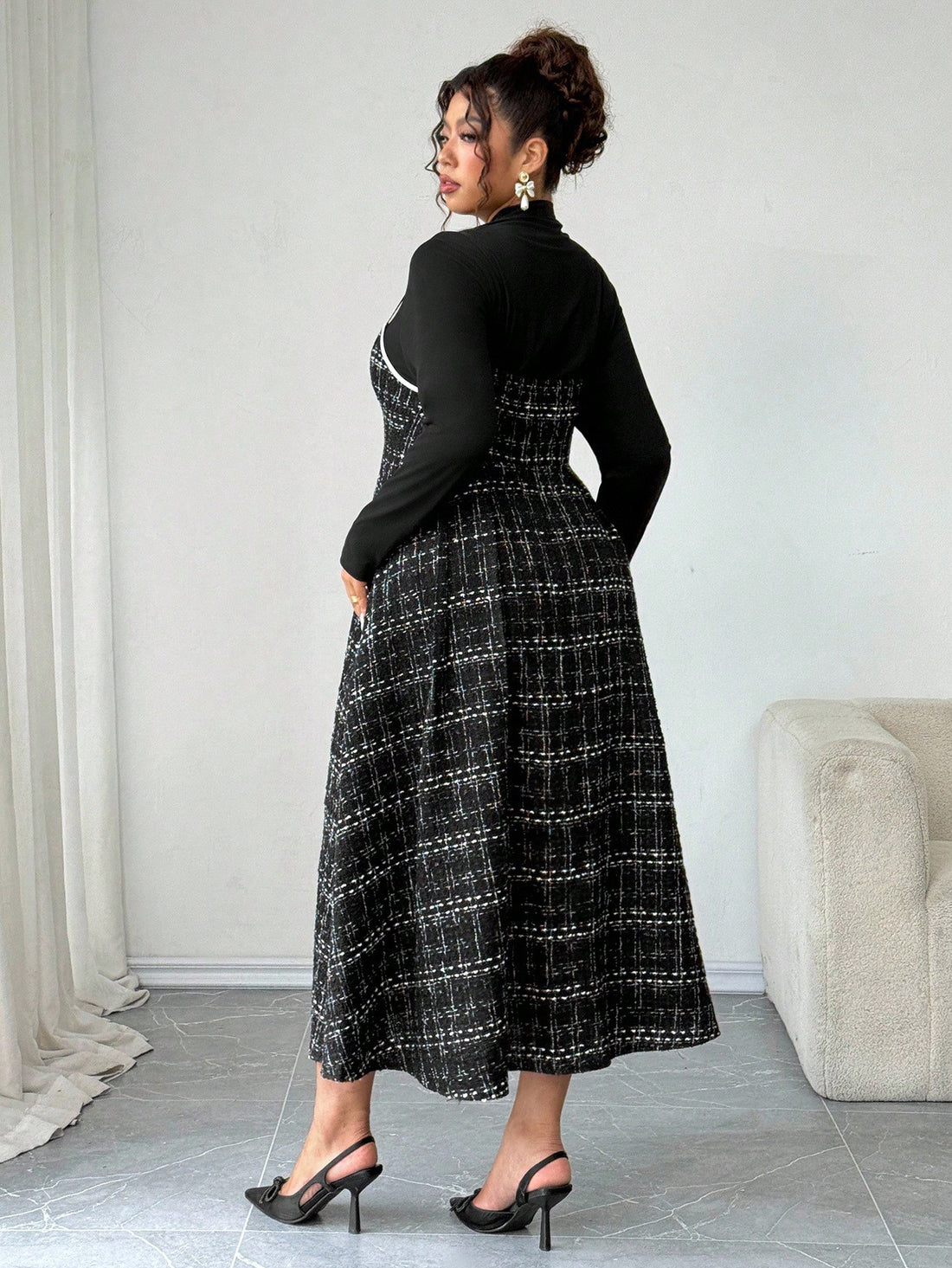 Elevate your fall wardrobe with this chic dual-tone midi slip dress that celebrates curves with effortless sophistication. The fitted turtleneck adds a cozy, polished touch perfect for layering or wearing solo, while the flattering silhouette skims your figure beautifully. Transition seamlessly from casual brunches to evening gatherings in a piece that's equal parts elegant and fun. Available in plus sizes because style has no limits.