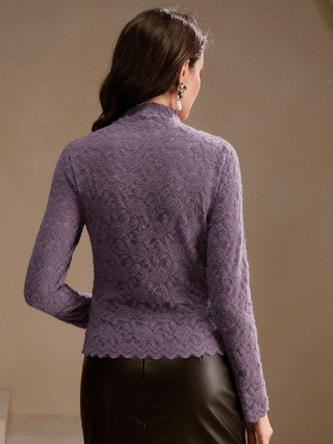 Elevate your everyday style with this charming purple floral lace turtleneck—where romance meets practicality. The delicate lace detailing adds a touch of whimsy, while the fitted turtleneck keeps you cozy and chic. Perfect as a standalone statement piece or layered under your favorite sweater, this tee brings personality to any outfit. Whether you're channeling vintage vibes or modern elegance, this playful essential proves that base layers don't have to be boring. Slip it on and let your romantic side shi