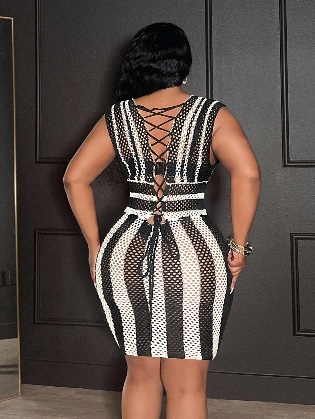 Step into sunny days with this playful plus size striped tie-front crochet knit mini dress. Perfect for spring and summer beach vacations, it combines breezy comfort with flirty style. The tie-front detail adds a fun twist, while the lightweight crochet knit keeps you cool as you soak up the sun. Bring your beachside wardrobe to life with this vibrant, easy-to-wear dress made to celebrate your curves and carefree spirit.