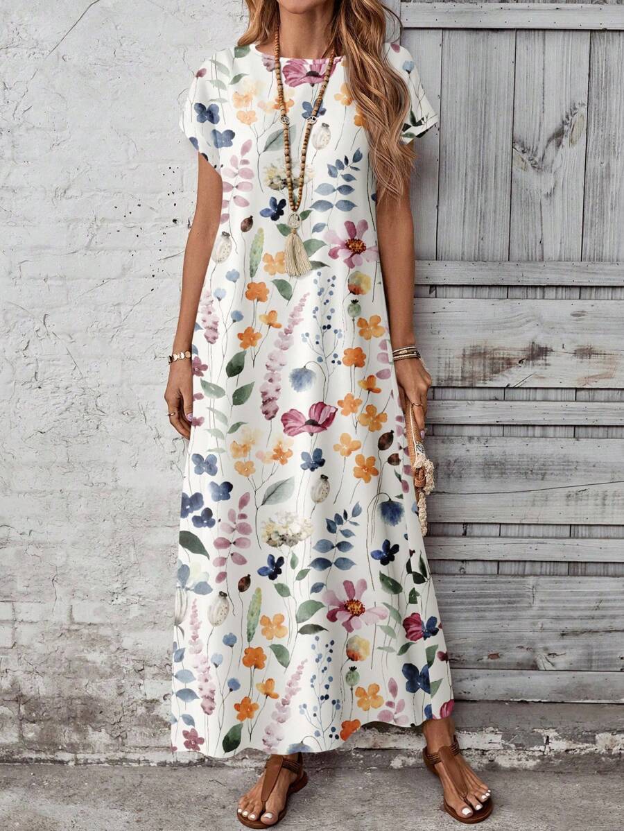 Studio front view of watercolor floral maxi dress with round neckline