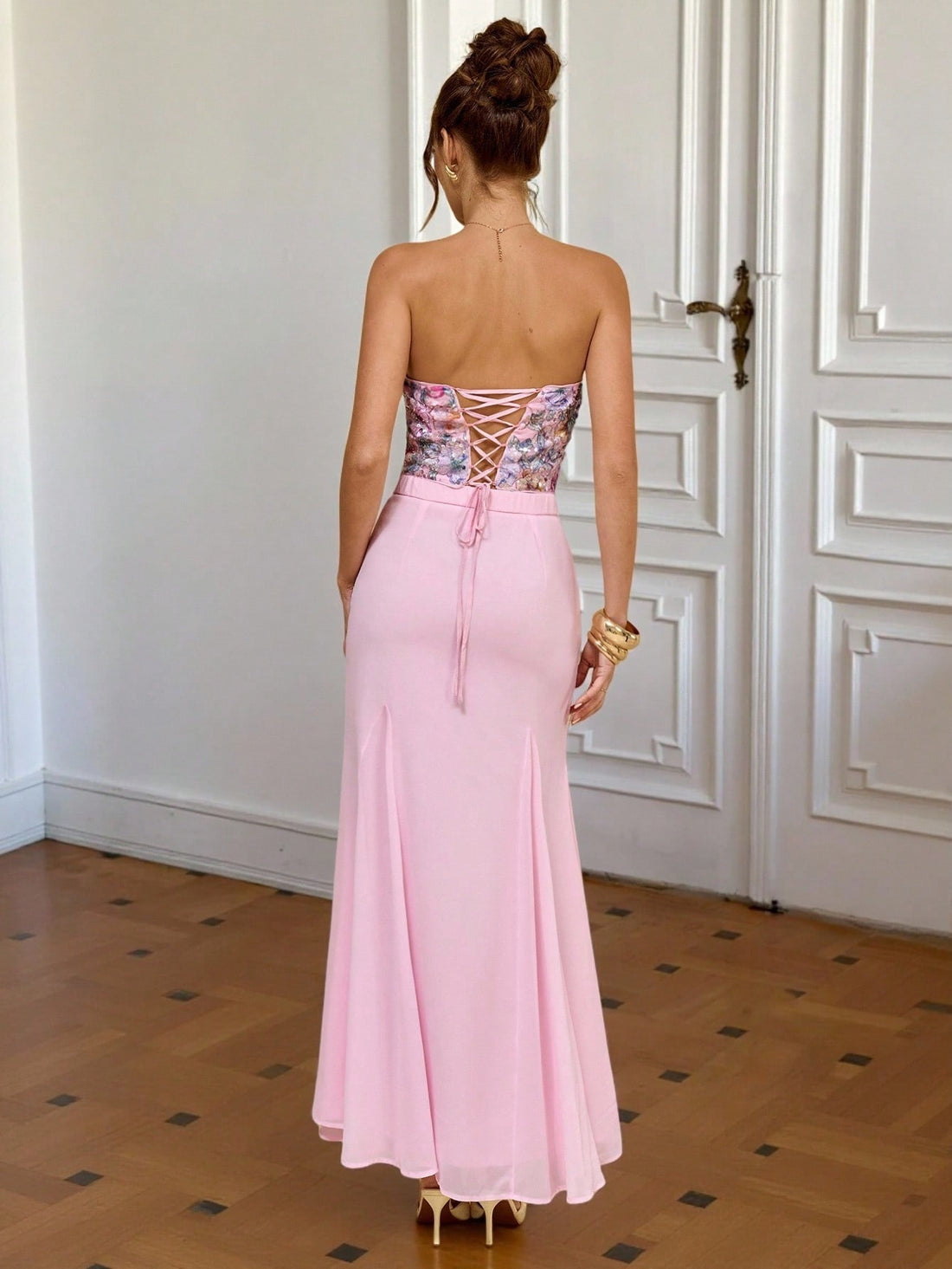 Turn heads this season in our stunning pink strapless dress, where dimensional floral details meet flattering silhouette. The fitted bodice hugs your curves perfectly, while the dramatic fishtail hem adds a touch of glamour and movement with every step. Whether you're heading to a summer date night or jetting off on vacation, this show-stopping piece delivers the perfect blend of elegance and fun. Pair it with strappy heels and minimal jewelry to let the dress do the talking!