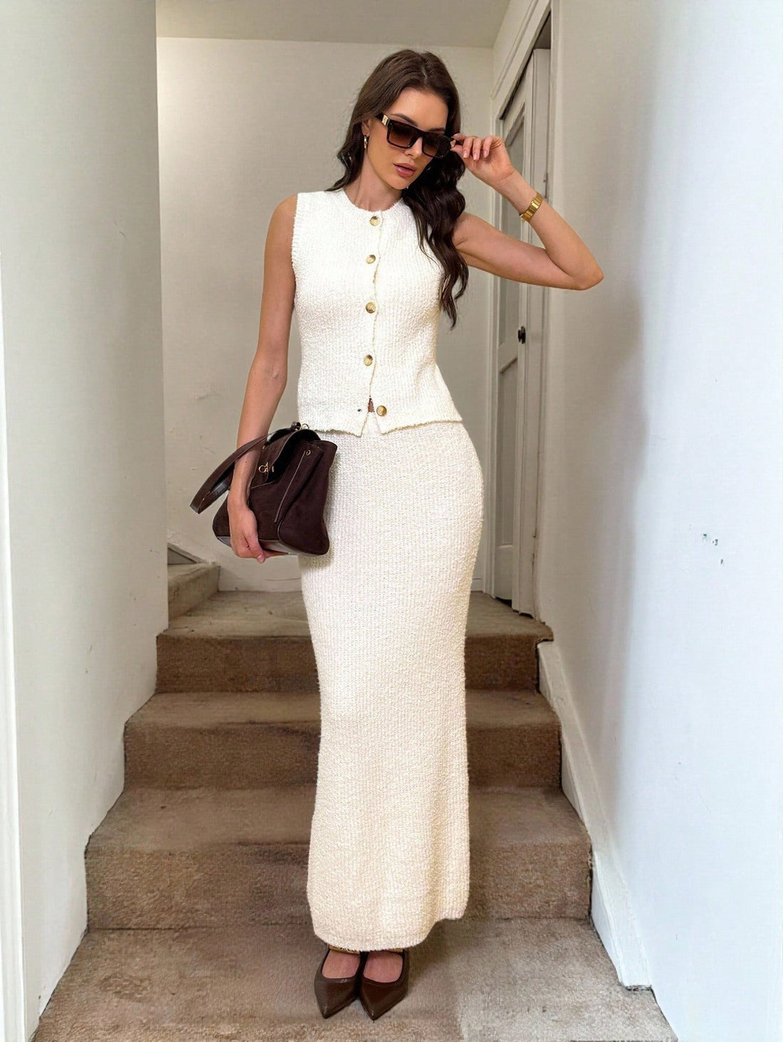 Elevate your wardrobe with this fabulous two-piece set that's basically your new best friend! Pair the cozy knit vest with the sleek skirt for instant polish—whether you're crushing it at the office or keeping things casual on the weekend. The perfect autumn-winter combo that transitions seamlessly from boardroom to brunch. Comfortable, chic, and ready to make you feel absolutely amazing in every setting.