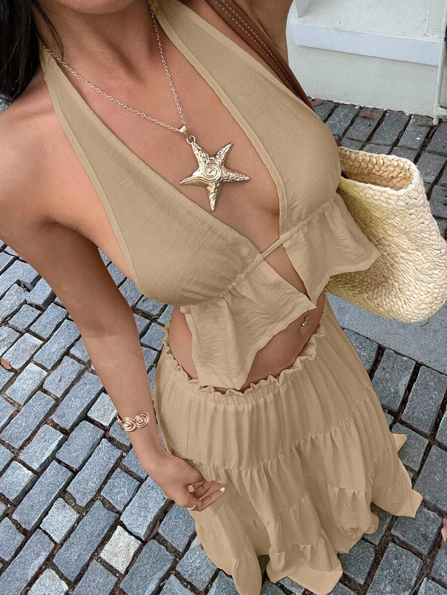 Effortless summer elegance meets everyday versatility with this stunning two-piece set. The halter top features a flattering neckline and breathable linen construction, while the ruffle maxi skirt adds graceful movement and dimension. Perfect for beach getaways, garden parties, or casual weekend outings, this yellow ensemble transitions seamlessly from day to night. 
