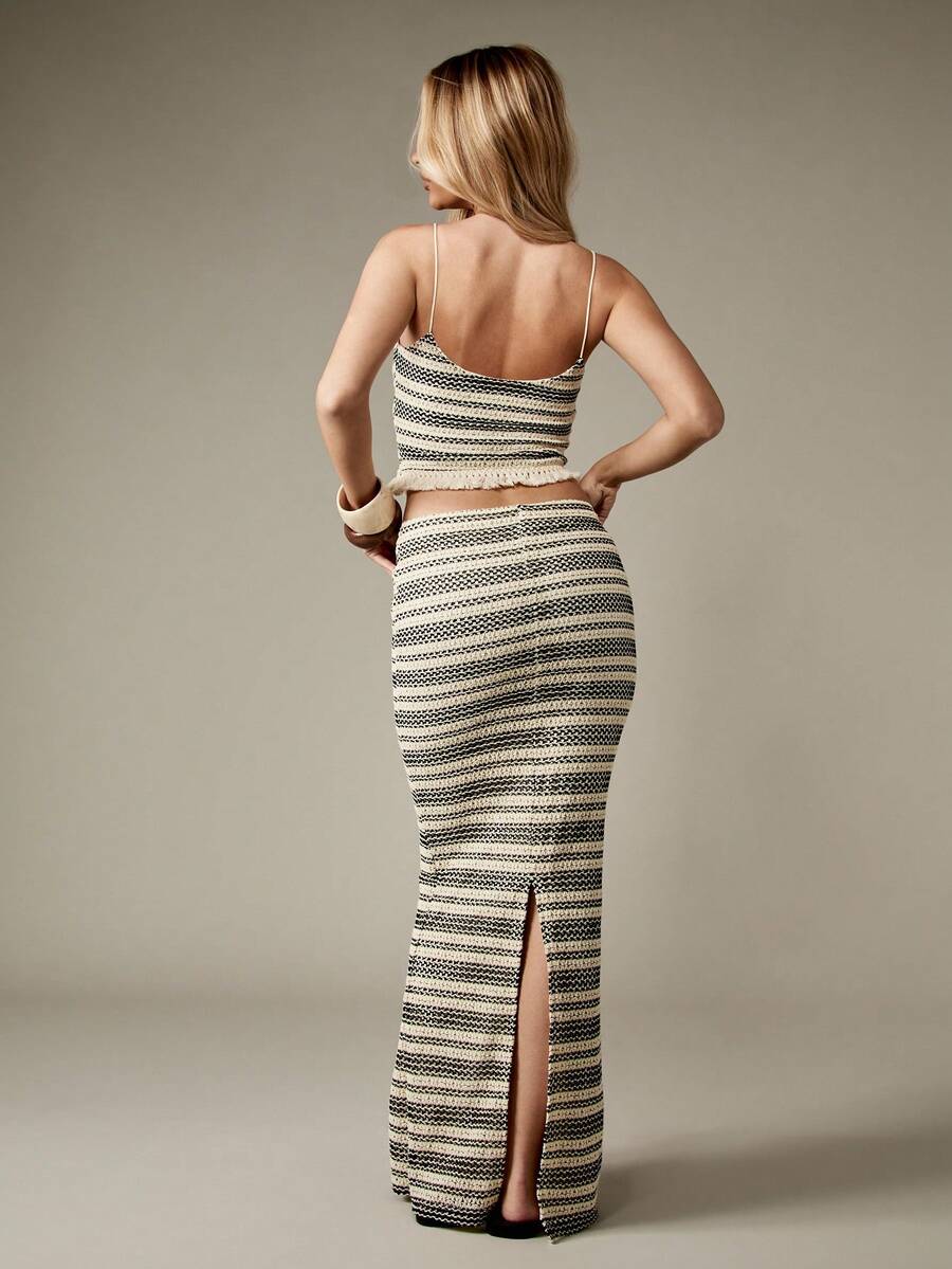 Embrace your free-spirited side with this stunning boho crochet two-piece set! Featuring delicate openwork detailing and a flowing maxi silhouette, it's the ultimate festival and beach essential. The lightweight, breathable crochet fabric keeps you cool while the relaxed fit celebrates your natural beauty. Mix and match the pieces for endless styling possibilities, or wear them together for that effortlessly chic bohemian vibe. Whether you're dancing under the stars or lounging by the ocean, this set delive