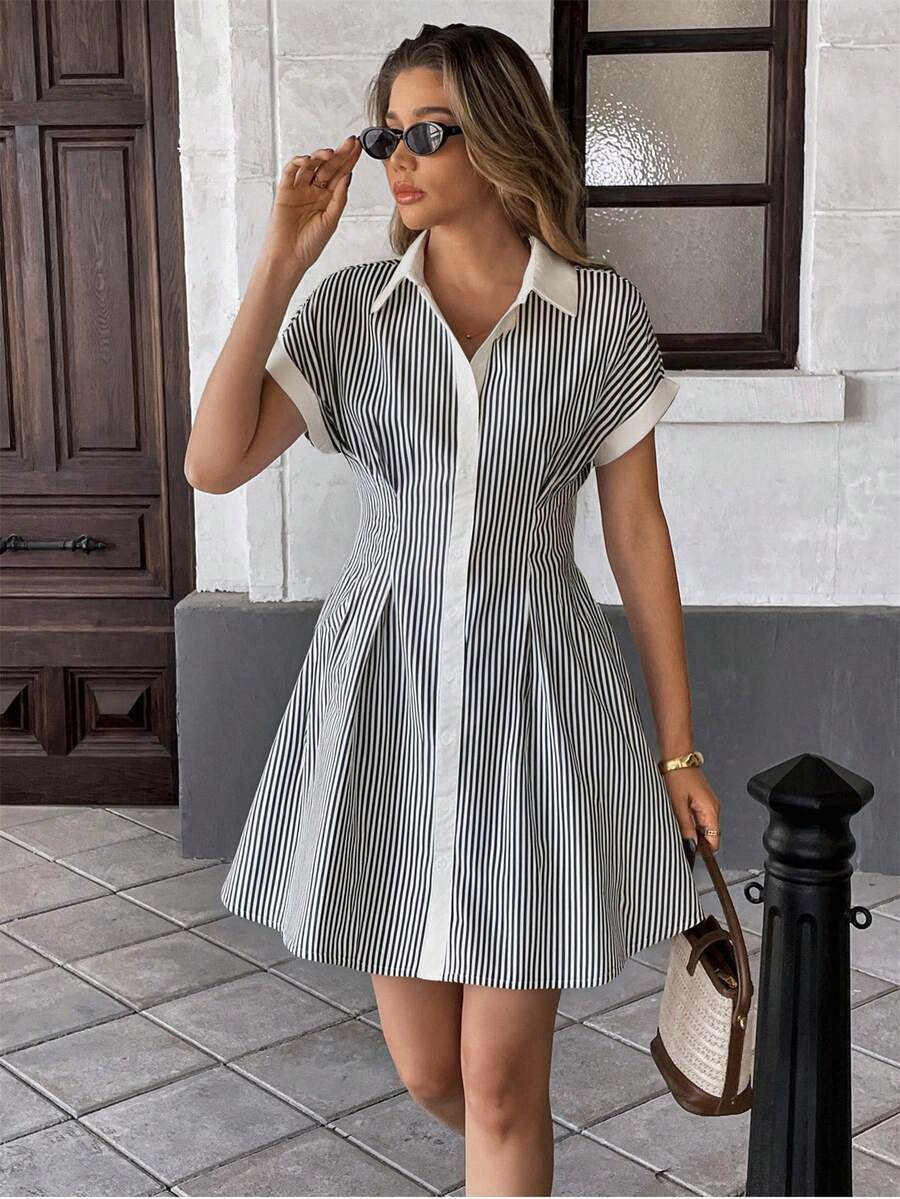 Step into vacation mode with this playful blue and white striped shirt dress. Its mid-length cut and cinched waist create a flattering silhouette perfect for sunny days and beach strolls. Lightweight and breezy, this dress blends comfort with effortless style—your go-to for an easy yet chic getaway look.