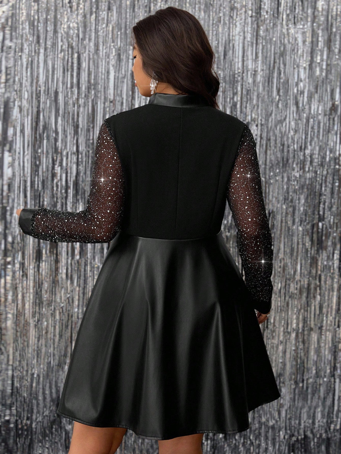 Step out in style with this Elegant Plus-Size Shiny Mesh & PU Dress, designed to add a little sparkle to your fall and winter wardrobe. Featuring a sleek zipper and a shiny mesh overlay paired with supple PU accents, this dress brings a playful twist to cooler season occasions. Comfortable and eye-catching, it’s perfect for those chilly nights when you want to shine bright without sacrificing warmth or confidence.