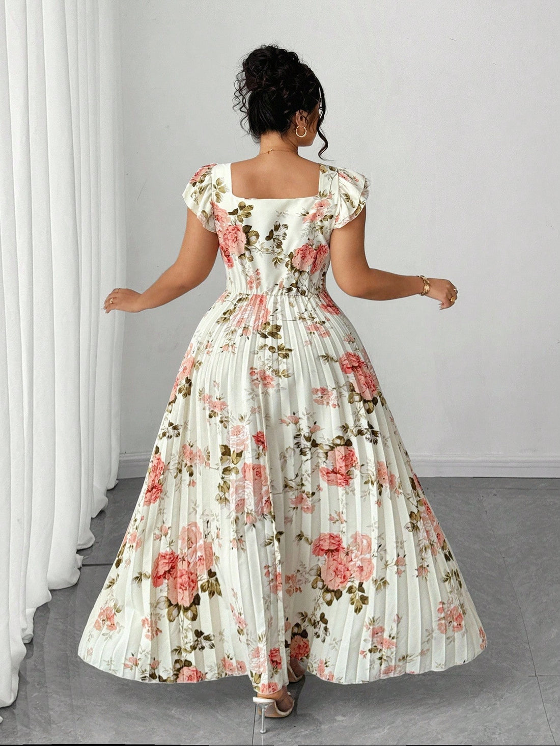 Twirl into your next adventure in this stunning vintage-inspired maxi dress! Designed for the modern woman who loves timeless elegance, this plus-size beauty features a romantic floral print that whispers sophistication. The charming flounce sleeves add a playful touch while keeping things effortlessly chic—perfect whether you're sipping cocktails on a beach getaway or enjoying a special evening out. The flowing silhouette flatters every curve, making you feel confident and gorgeous from sunrise to sunset. 