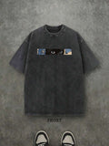 Front view of washed black cat floral graphic T-shirt with cat eyes and flower print