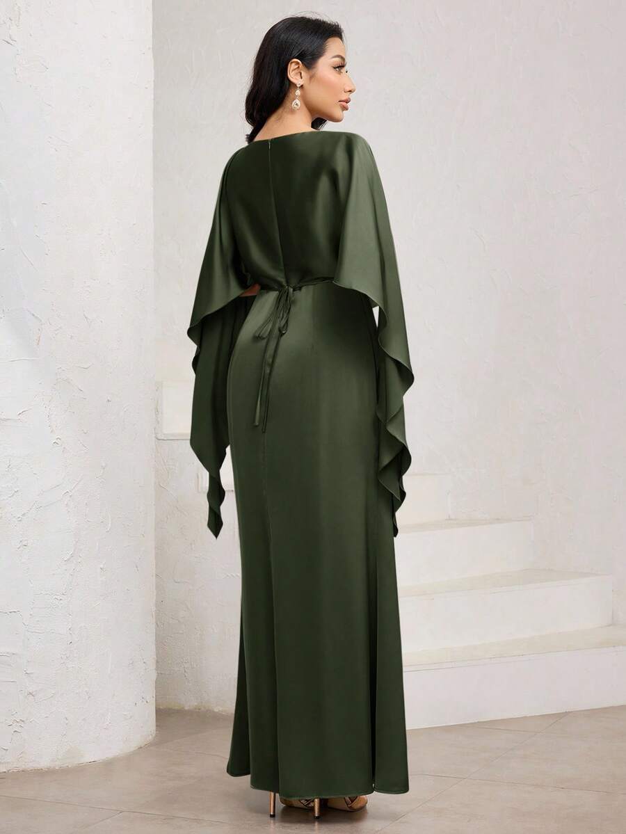 Make a statement at your next special occasion in this stunning mocha brown satin gown. Luxurious draping cape sleeves add dramatic flair while the graceful fish tail hem creates an enchanting silhouette that turns heads as you move. The rich, sophisticated color flatters all skin tones, making it an ideal choice for weddings, galas, and unforgettable celebrations. Slip into elegance and let this show-stopping dress do the talking.