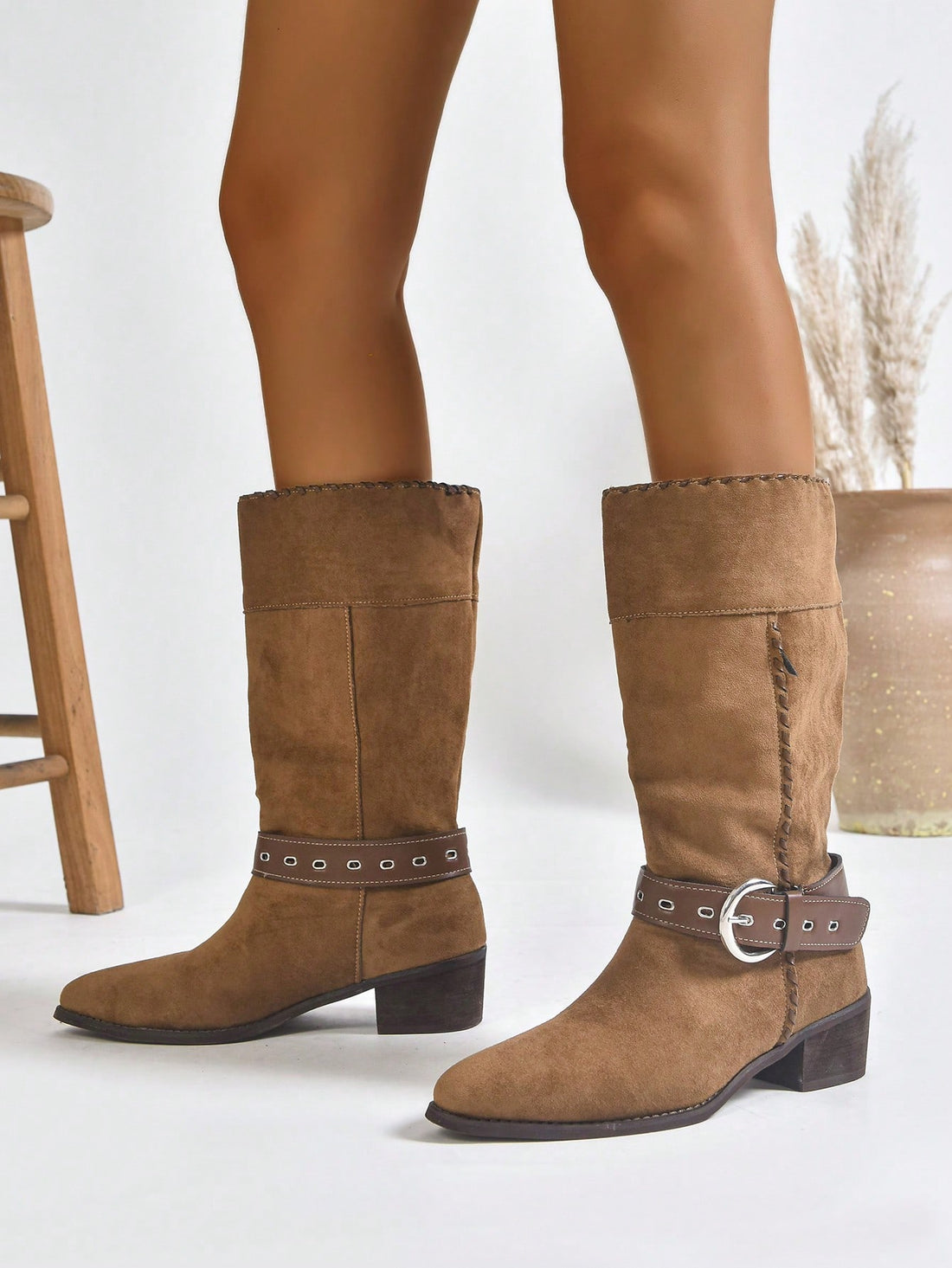 Step into the spotlight with these Western-inspired short boots that blend classic cowboy vibes with modern edge. Featuring a sharp pointed toe and sturdy mid-heel, they're the perfect partner for everything from weekend denim to dress-up occasions. The thick heel keeps you grounded and comfortable all day long, while the chic silhouette adds instant personality to any outfit. Whether you're channeling your inner rodeo queen or just want boots with serious attitude, these versatile stunners deliver style th
