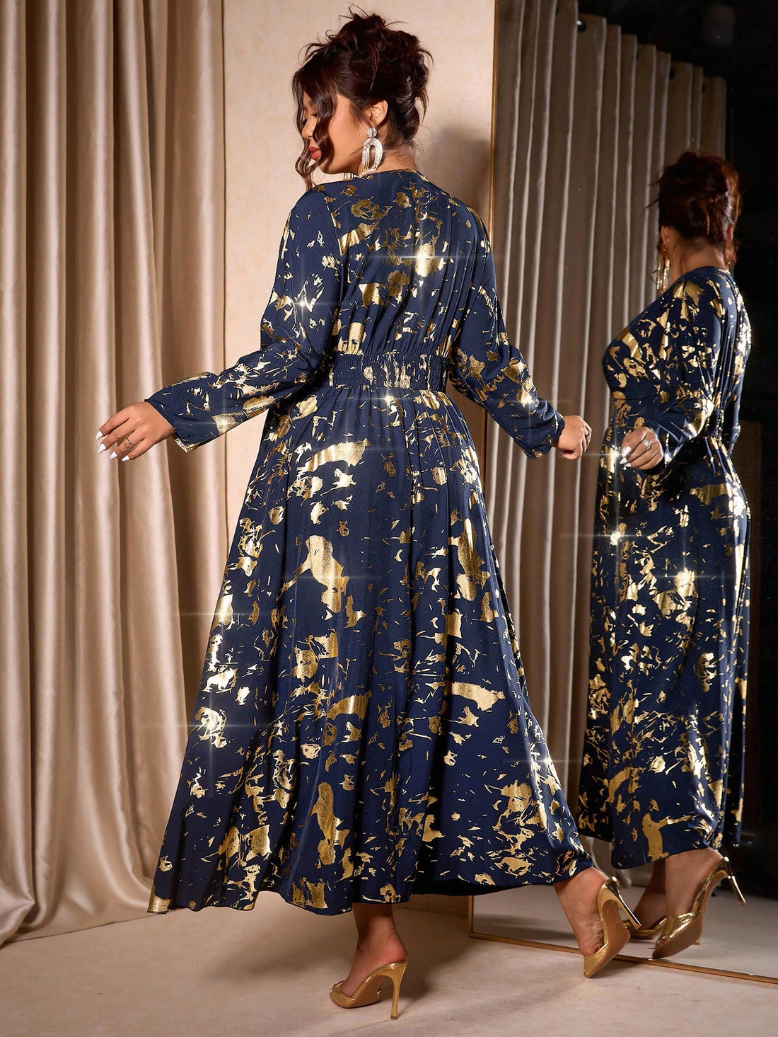 Shimmer into the season with this show-stopping metallic foil print dress! Designed for curves and confidence, this plus-size beauty features a flattering V-neckline and cinched waist that celebrates your silhouette. The eye-catching foil detailing catches the light with every move, making it perfect for holiday parties, festive gatherings, or any occasion calling for a touch of glamour. Comfortable yet chic, this dress proves that elegance comes in every size. Get ready to turn heads and feel absolutely fa