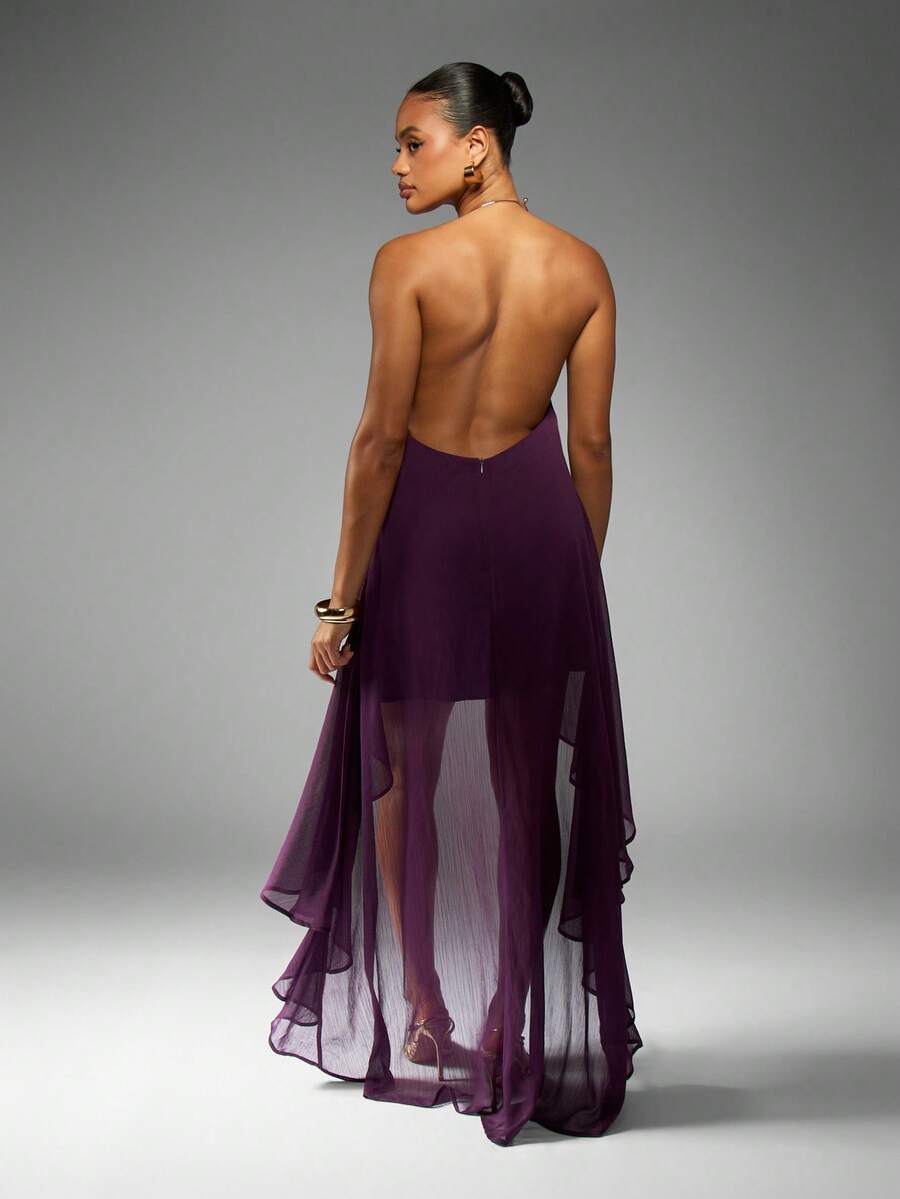 Make a statement at your next special occasion in this stunning purple chiffon maxi dress. Featuring an elegant draped halter neckline and flattering high-low hemline, this piece combines sophistication with modern flair. The backless design and asymmetrical cut create a graceful silhouette, while the A-line shape ensures comfortable movement. Crafted from 100% polyester with a lined interior, this dress transitions beautifully from summer weddings to evening celebrations. The loose fit accommodates all bod