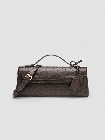 Ostrich embossed structured top handle shoulder bag with flap closure and adjustable strap