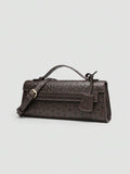 Ostrich embossed structured top handle shoulder bag with flap closure and adjustable strap
