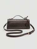 Ostrich embossed structured top handle shoulder bag with flap closure and adjustable strap