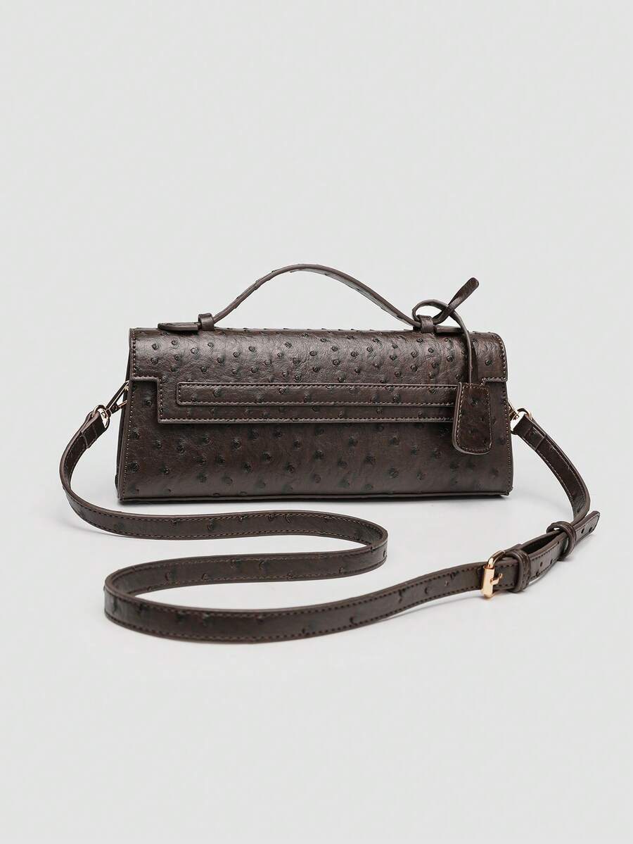 Ostrich embossed structured top handle shoulder bag with flap closure and adjustable strap