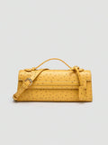 Ostrich embossed structured top handle shoulder bag with flap closure and adjustable strap