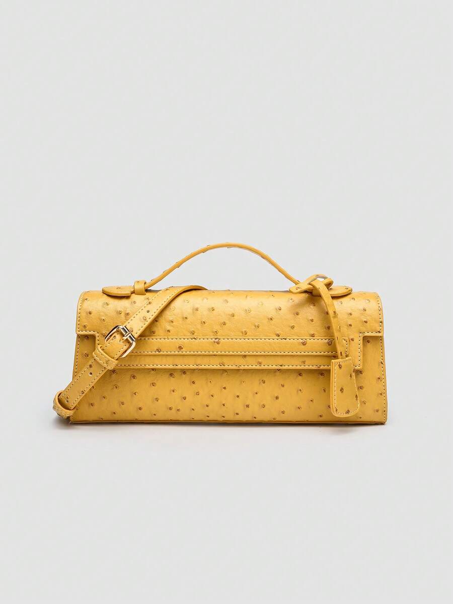 Ostrich embossed structured top handle shoulder bag with flap closure and adjustable strap