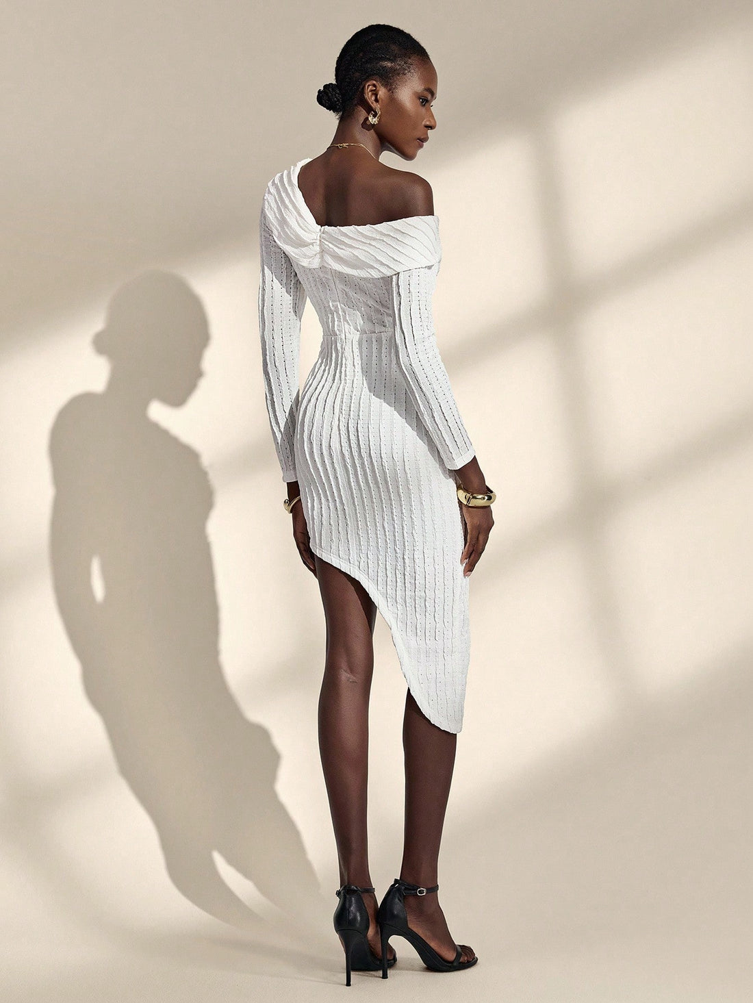 Bonjour! Here's your product description: Ooh là là, this isn't your average dress! Our French-inspired asymmetrical hem dress brings that effortless Parisian charm with a playful twist. The unique shoulder design catches eyes while the mid-length cut keeps things chic and wearable for any occasion. Whether you're heading to brunch or a night out, this dress proves that a little asymmetry goes a long way. Très magnifique!