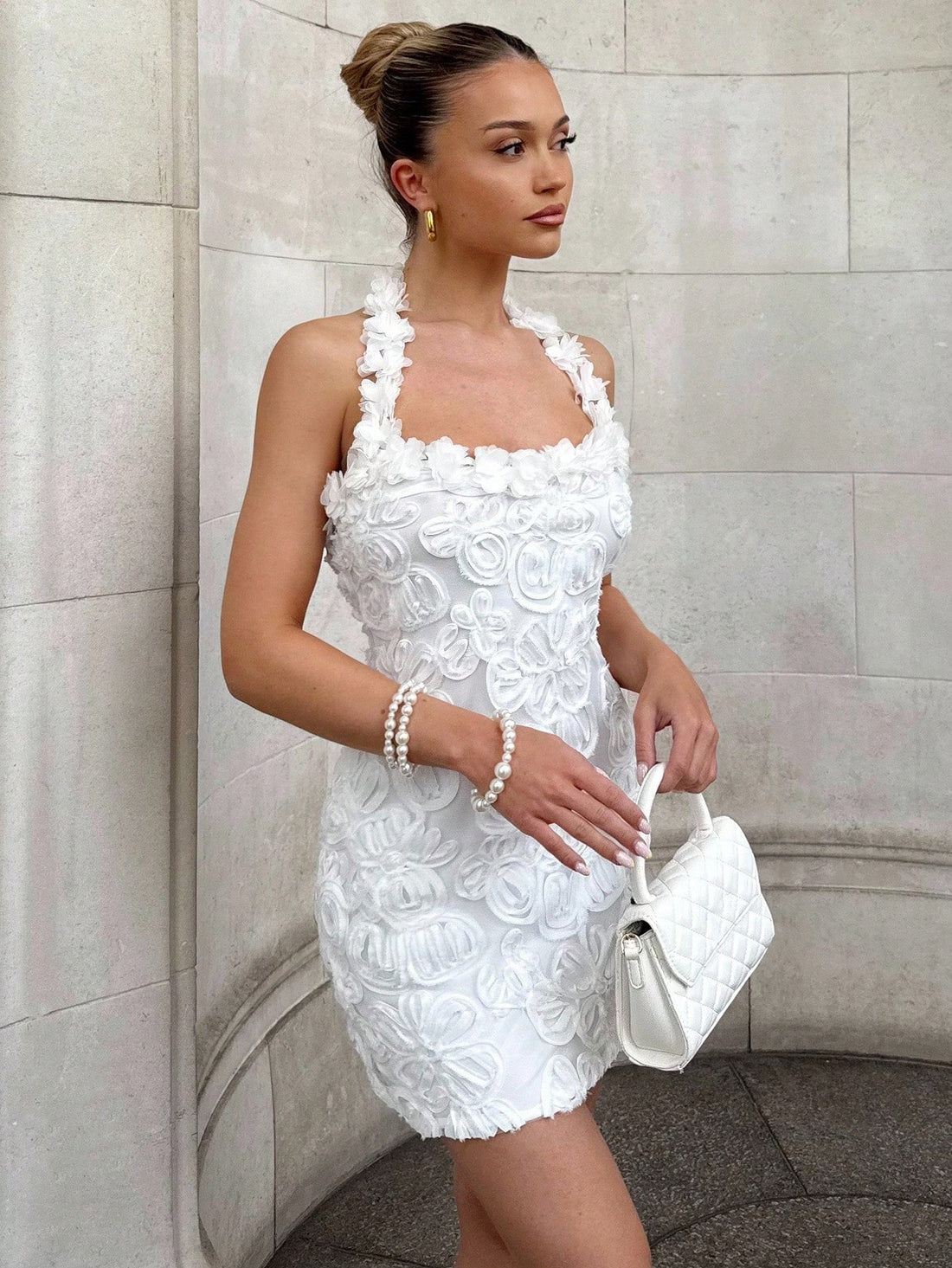 Turn heads at your next summer celebration in this stunning backless mini dress. Delicate embroidery and shimmering sequins create an eye-catching design that transitions effortlessly from beachside weddings to tropical getaways. The daring open back adds a flirty touch while the fitted silhouette flatters your figure. Whether you're dancing under the stars or sipping cocktails by the pool, this dress delivers the perfect blend of elegance and fun. Pack it for your next adventure and watch the compliments r