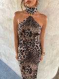 Close up of leopard print dress showing one shoulder halter cutout and gold connector