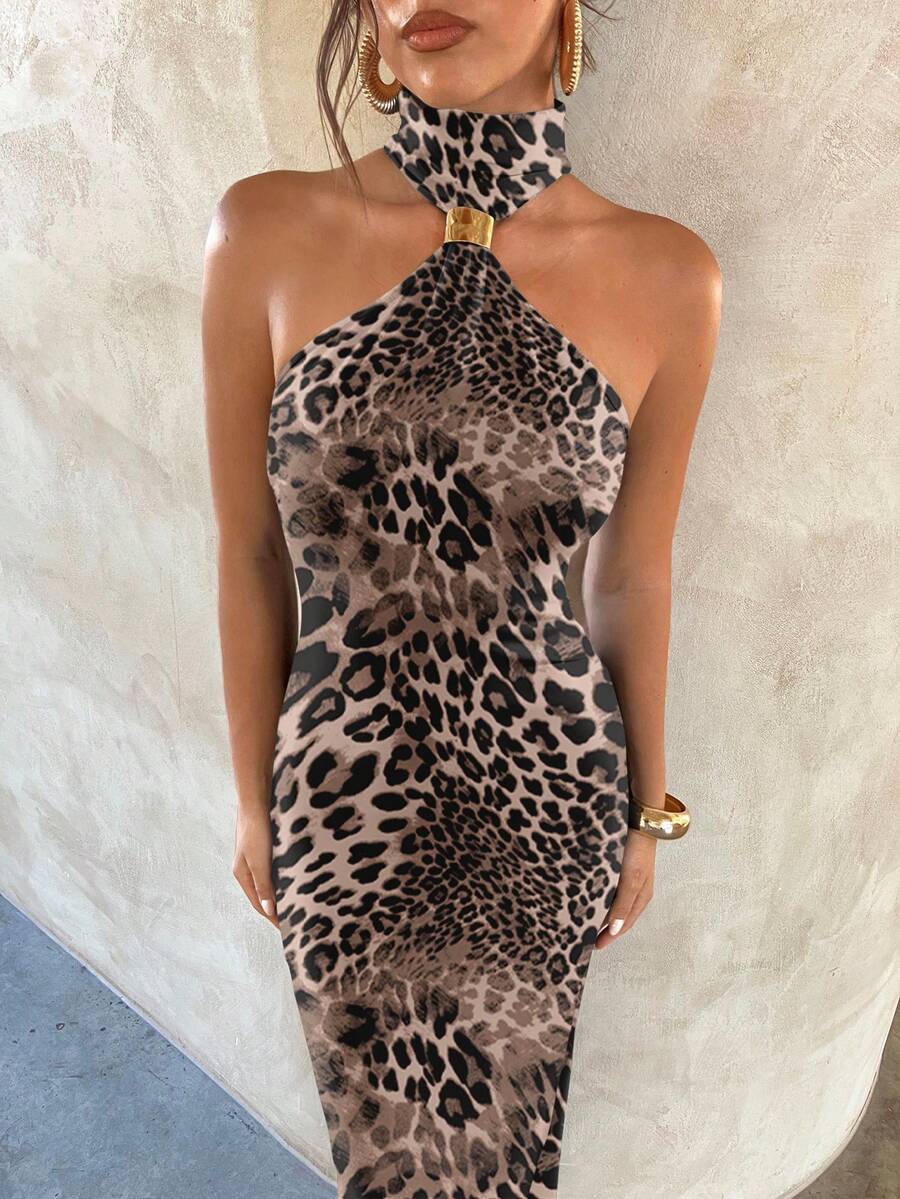 Close up of leopard print dress showing one shoulder halter cutout and gold connector