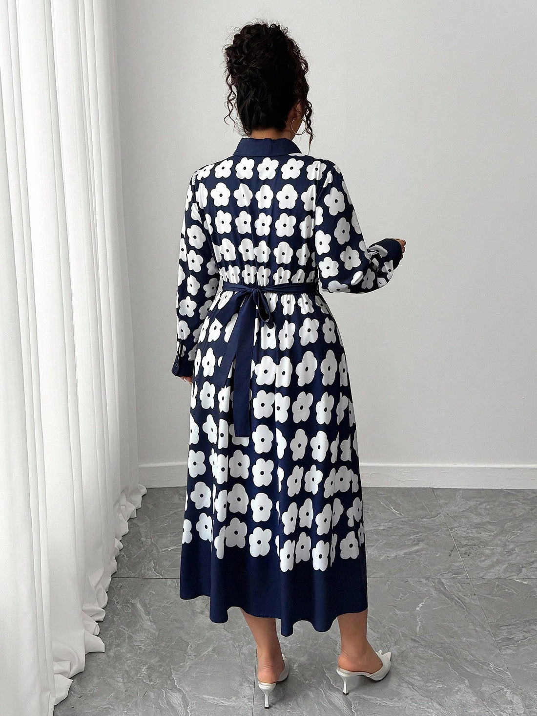 Elevate your autumn wardrobe with this charming floral print dress that effortlessly blends sophistication with seasonal style. The crisp collar and flowing long sleeves create a polished silhouette perfect for everything from casual coffee dates to weekend brunches. Rich botanical patterns bring life to your everyday looks, while the thoughtful tailoring ensures you'll feel confident and comfortable all day long. A versatile piece that transitions beautifully from fall into winter—your new go-to for lookin