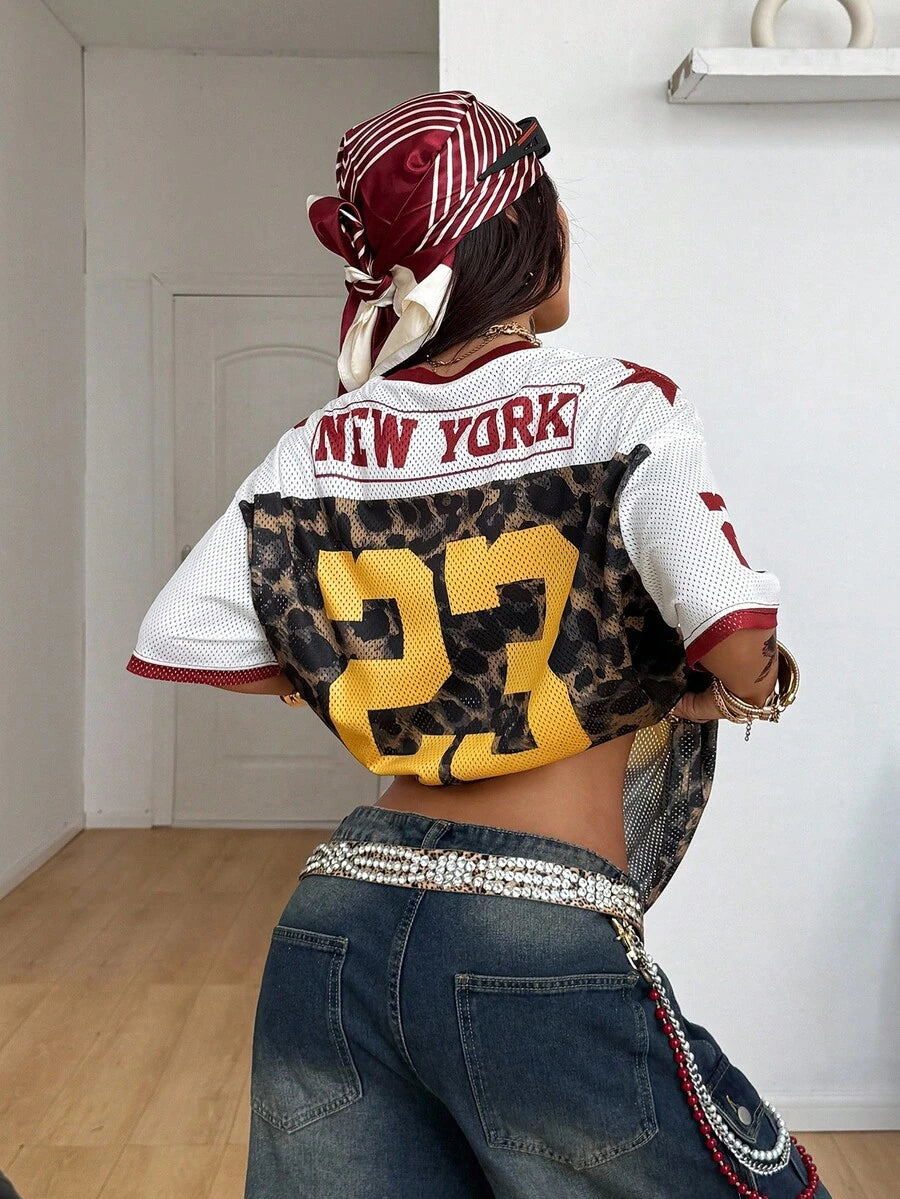 Front view of white leopard oversized baseball jersey T-shirt with gold 23 graphic