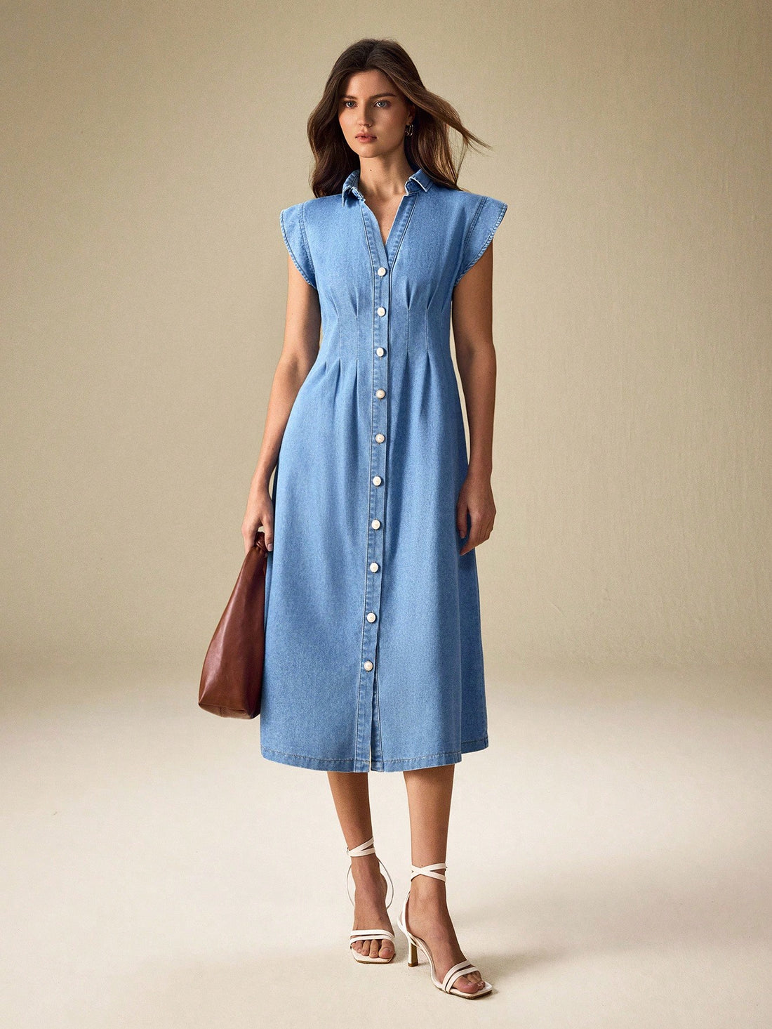 Effortlessly cool meets timeless charm in this vintage-inspired denim dress. Designed for the modern commuter who refuses to sacrifice style for comfort, it features classic front button detailing that adds character and makes dressing up (or down) a breeze. The relaxed silhouette works beautifully with sneakers for weekend errands or dressed up with boots for casual office days. Perfect for anyone who loves that "I just threw this on" vibe—except you totally planned it. Versatile, comfortable, and undeniab