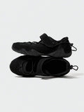 Stacked side-top view of black adjustable mesh water shoes with rounded toes