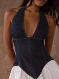 Close-up of dark denim halter dress bodice with deep V neck and basque waist