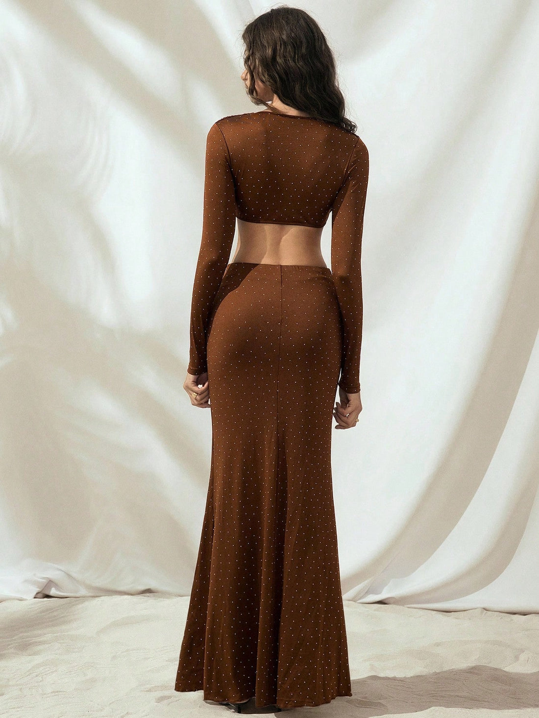 Make a bold statement this fall with our Women's Long Sleeve Rhinestone Hollow-Out Dress. Sparkling rhinestone accents catch the light beautifully, while strategic hollow-out details add an edgy, modern twist. The long sleeves keep you cozy as temperatures drop, making this the perfect piece for transitioning your wardrobe into the season. Dress it up for nights out or style it casually for weekend vibes—this versatile number does it all with undeniable flair.