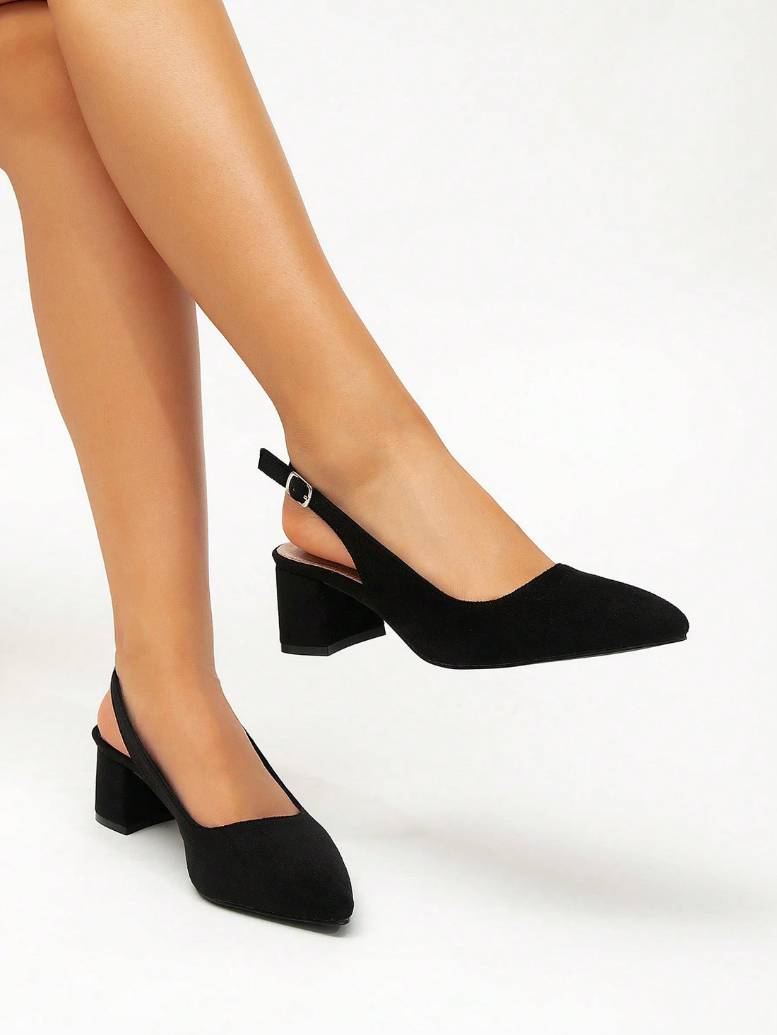 Step out in style and comfort with these black suede pointed toe shoes, designed for the busy woman on the go. The chunky heel adds a trendy twist while keeping your feet happy during those long office hours or your daily commute. Perfectly blending chic and practical, these shoes will have you striding confidently from desk to dinner with a playful flair.