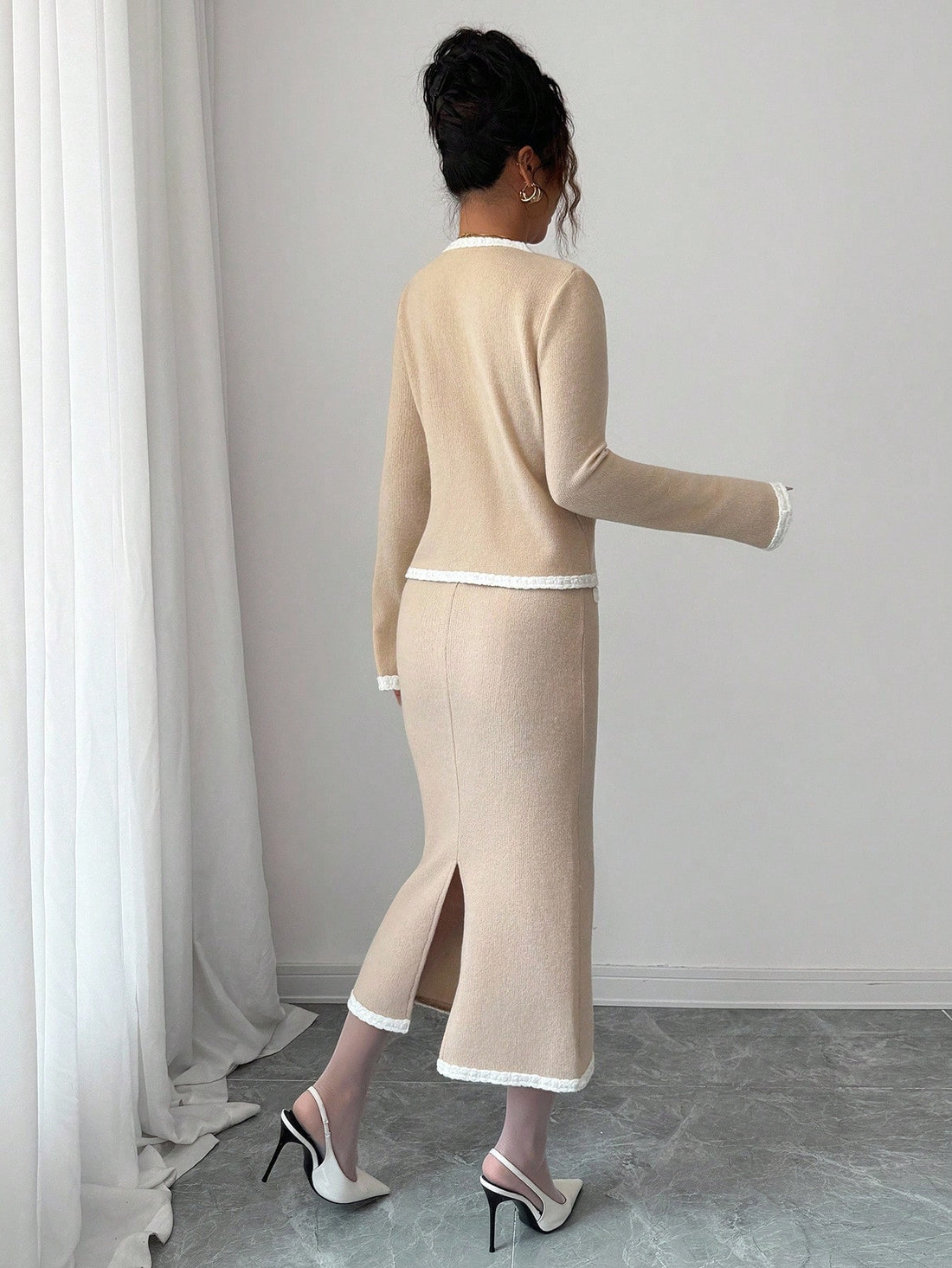 Snuggle into sophistication with this charming knit sweater and skirt duo designed for the fashion-forward woman. Soft, luxurious knit fabric keeps you toasty through chilly seasons, while intricate floral lace and eye-catching 3D rose embellishments bring an unexpected playful twist. Mix and match with your favorite pieces or wear the set together for an instantly polished look. From cozy weekends to special occasions, this versatile pairing proves that comfort and elegance can absolutely go hand in hand.