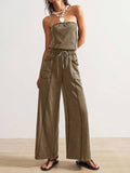 Front view of taupe brown strapless wide-leg jumpsuit with drawstring waist and patch pockets