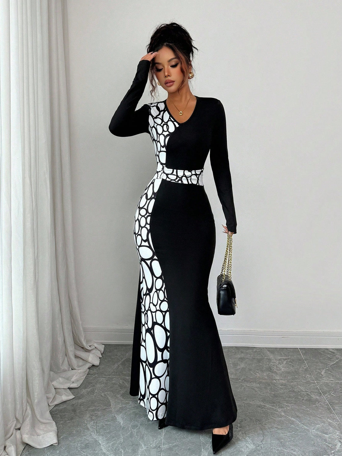 Turn heads in this stunning geometric print maxi dress that effortlessly transitions from casual coffee dates to evening celebrations. The flattering V-neck and bold color-block design create a modern silhouette that's equal parts chic and comfortable. Whether you're dressing up for a night out or keeping it relaxed on the weekend, this versatile piece proves that style doesn't have to be complicated. Perfect for anyone who loves making a statement without trying too hard.