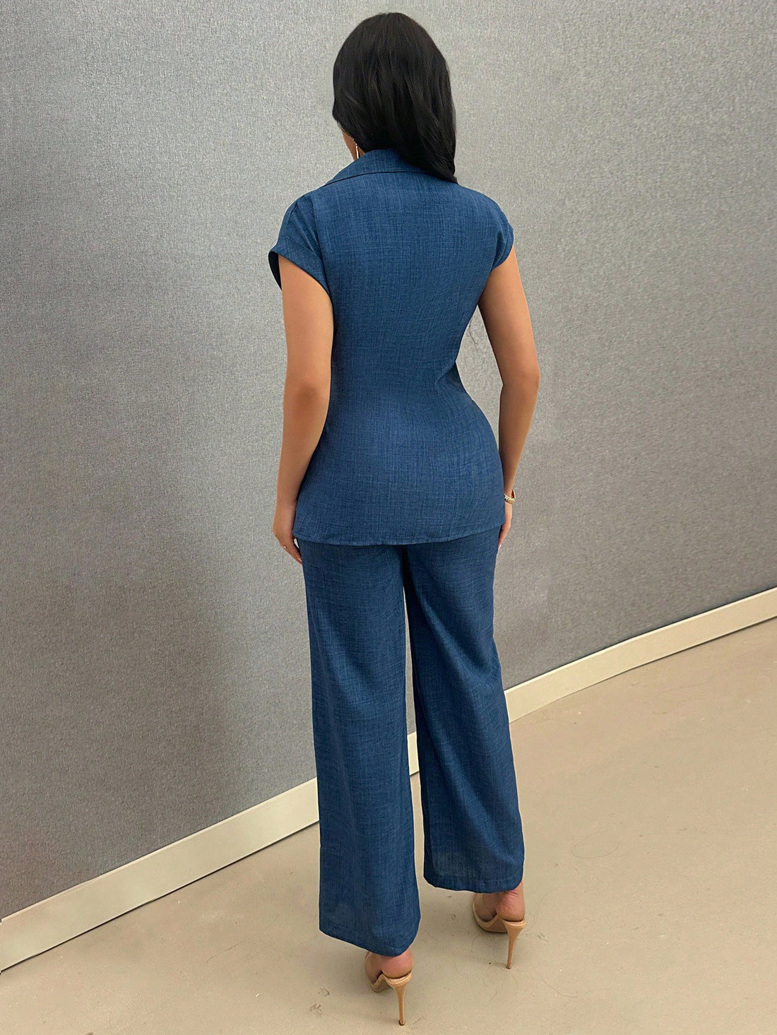 Elevate your everyday wardrobe with this sophisticated blue two-piece set. The blouse features a classic lapel collar, button-front closure, and elegant batwing sleeves, while the coordinating pants showcase a detachable bow accent and belted waist for a polished silhouette. Crafted from 100% polyester with slight stretch for comfort, this versatile ensemble transitions seamlessly from office to casual occasions. Perfect for work, weekend outings, or festive celebrations. Machine washable for easy care.