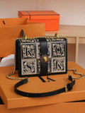 Interior view of black mini crossbody bag with zipper divider