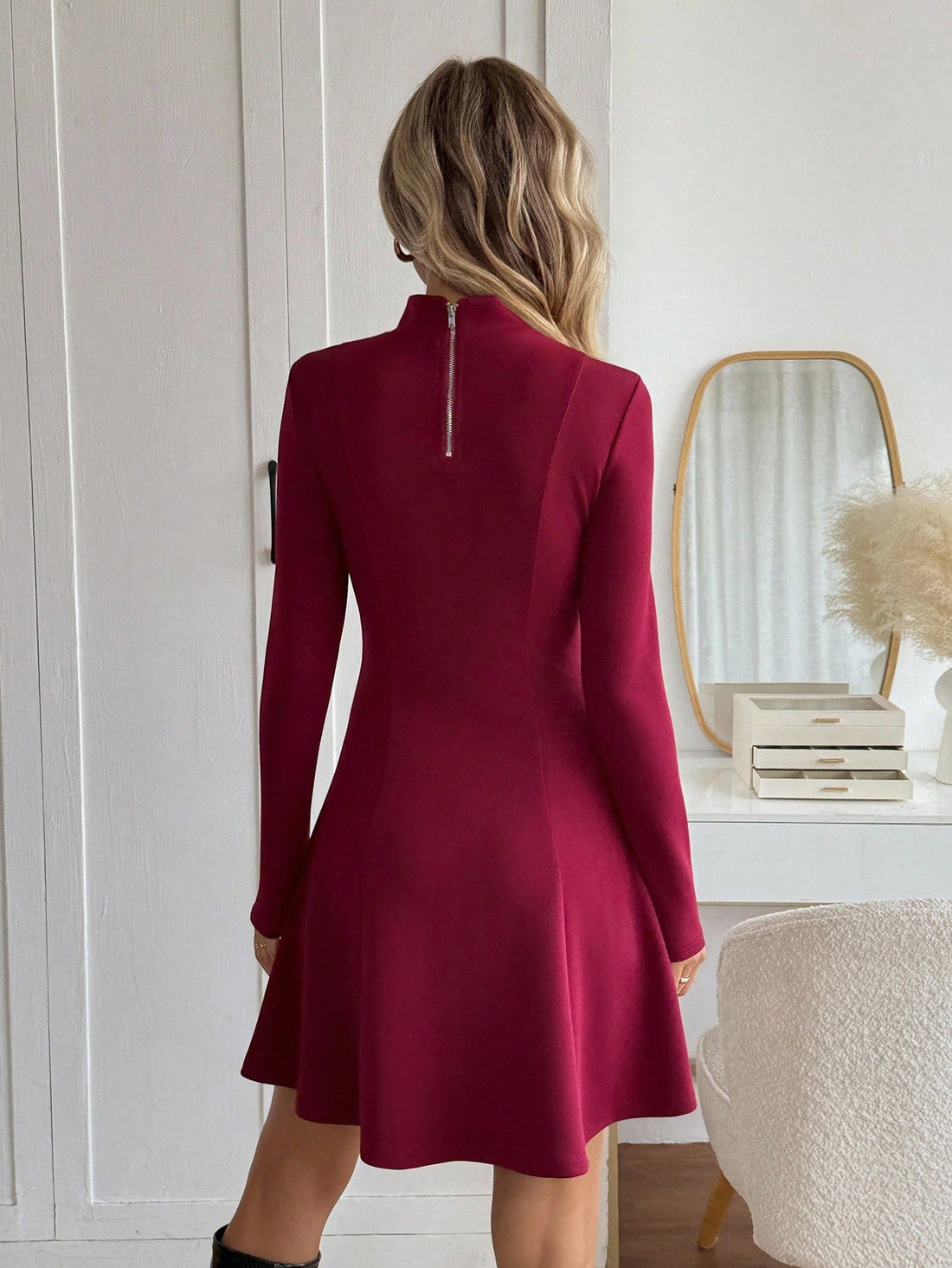 Step into timeless elegance with this stunning wine-hued midi dress that effortlessly blends retro charm with modern sophistication. The graceful A-line silhouette flatters every figure, while the high neckline and long sleeves deliver a polished, put-together look perfect for brunch dates, casual outings, or cozy gatherings. Crafted for comfort and style, this versatile piece transitions seamlessly from day to night, making it a wardrobe essential that'll have you feeling fabulous no matter the occasion.
